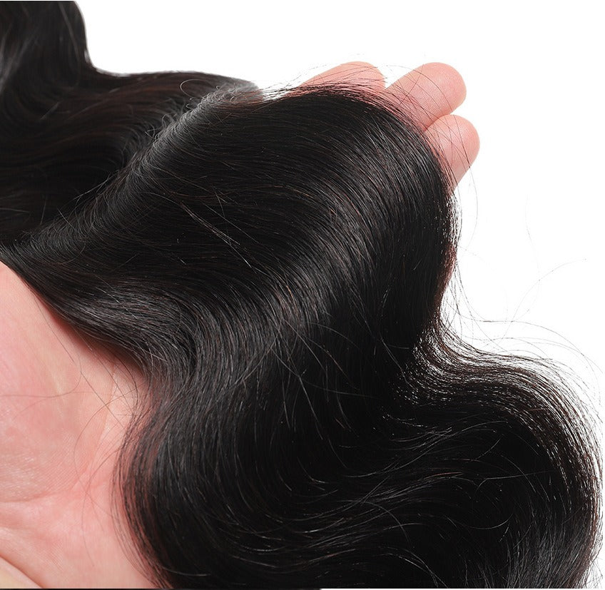 Close-up of 10A body wave hair, showing the smooth, shiny texture and defined wave pattern.