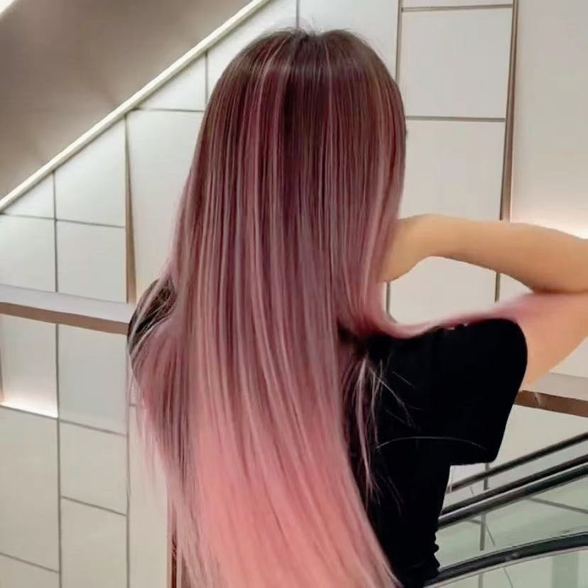 Pink-purple ombre feather hair extensions styled for a bold, vibrant balayage transformation