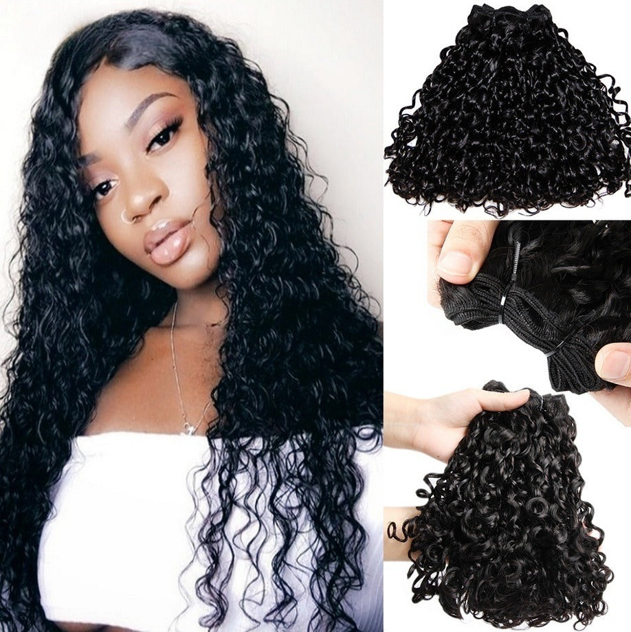 Model with voluminous 12A kinky curly hair, showcasing the defined curl pattern and bouncy texture.