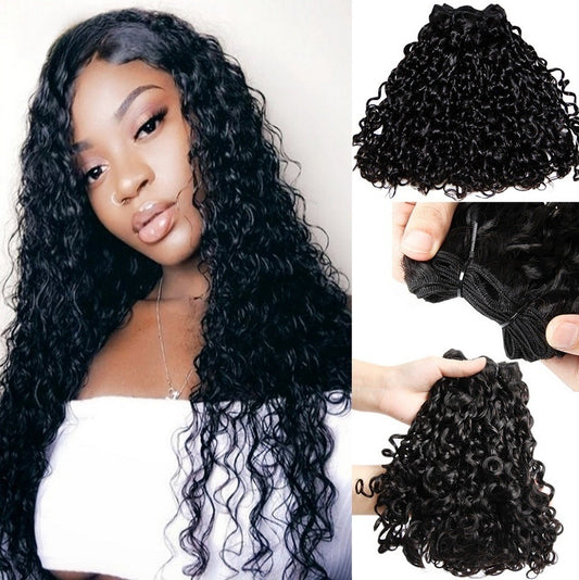 Model with voluminous 12A kinky curly hair, showcasing the defined curl pattern and bouncy texture.
