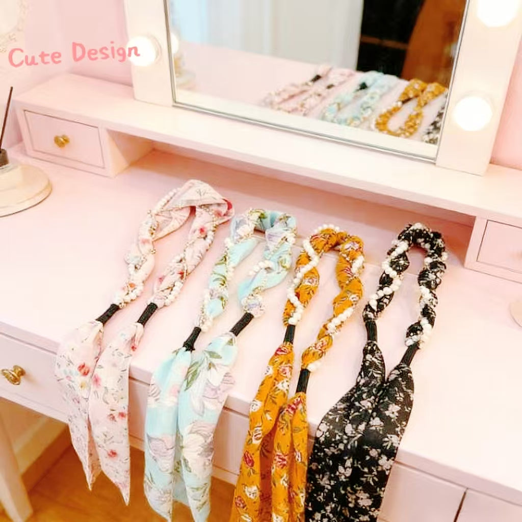Floral hair scarf headbands displayed on a vanity, perfect for retail or gifting