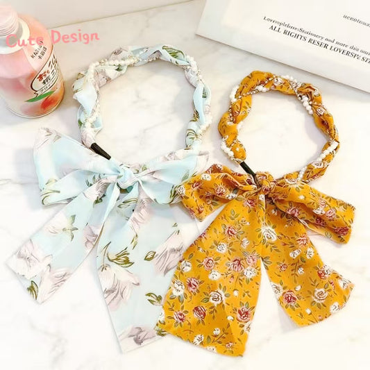 Floral print hair scarf headband with bow tie design, available in blue and yellow chiffon
