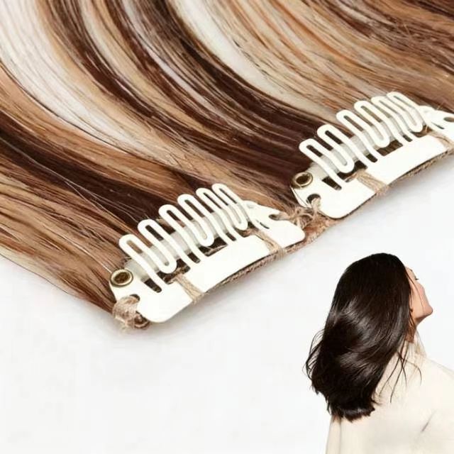Close-up of clip-in hair extensions showing balayage blonde straight texture and secure clips.
