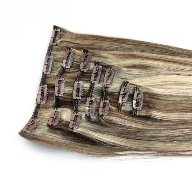 Clip-in hair extensions in darker ombre brown shade, highlighting the natural color transition.