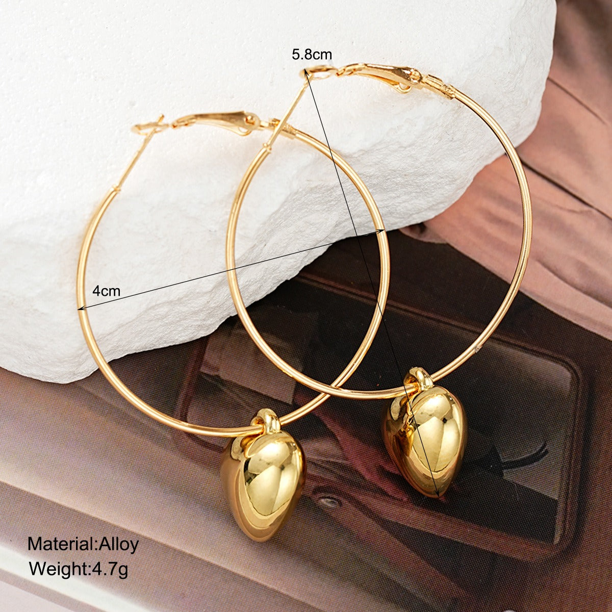 Smaller size gold heart hoop earrings, perfect for everyday wear and layering