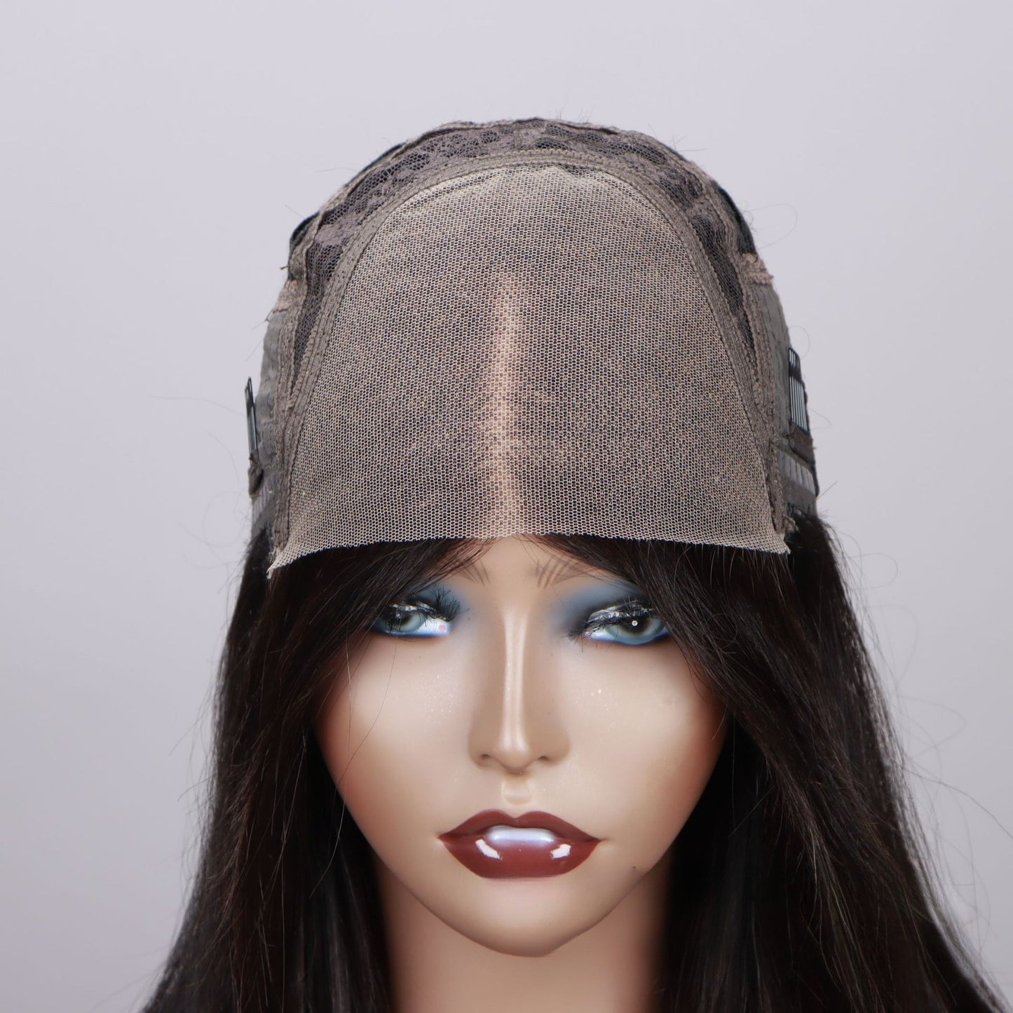 Close-up of 4*4 HD lace closure: thin transparent HD lace base on mannequin head
