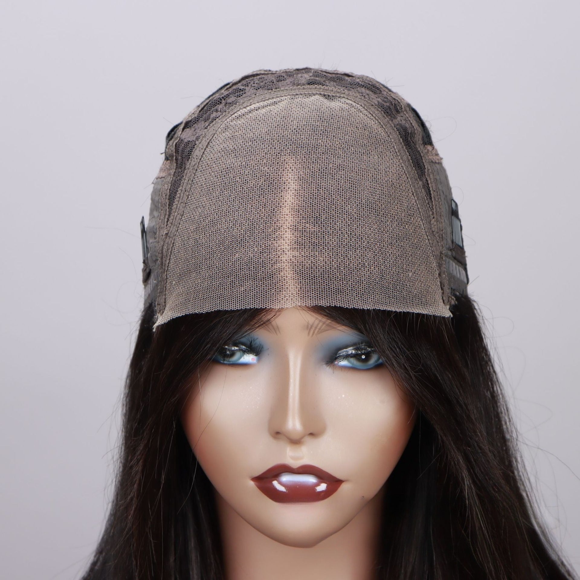 Close-up of 4*4 HD lace closure: thin transparent HD lace base on mannequin head