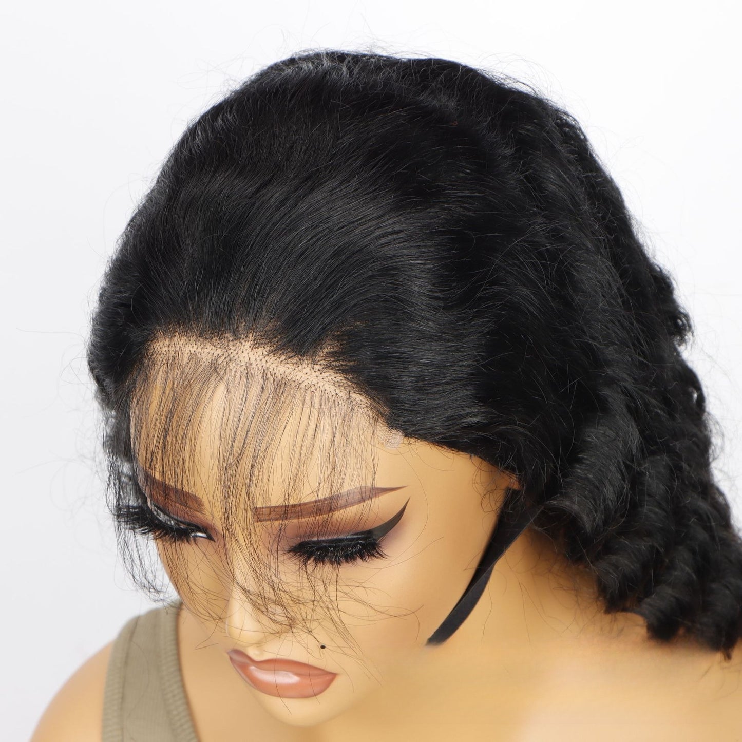 Front close-up of 5*5 HD glueless wig: displaying pre-plucked invisible hairline and deep wave texture