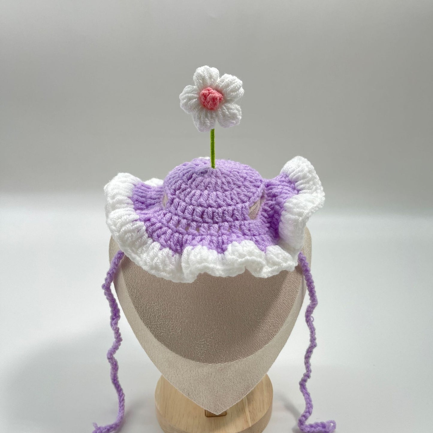 Purple plush pet birthday cake hat with a cake topper, designed for cats and small dogs.