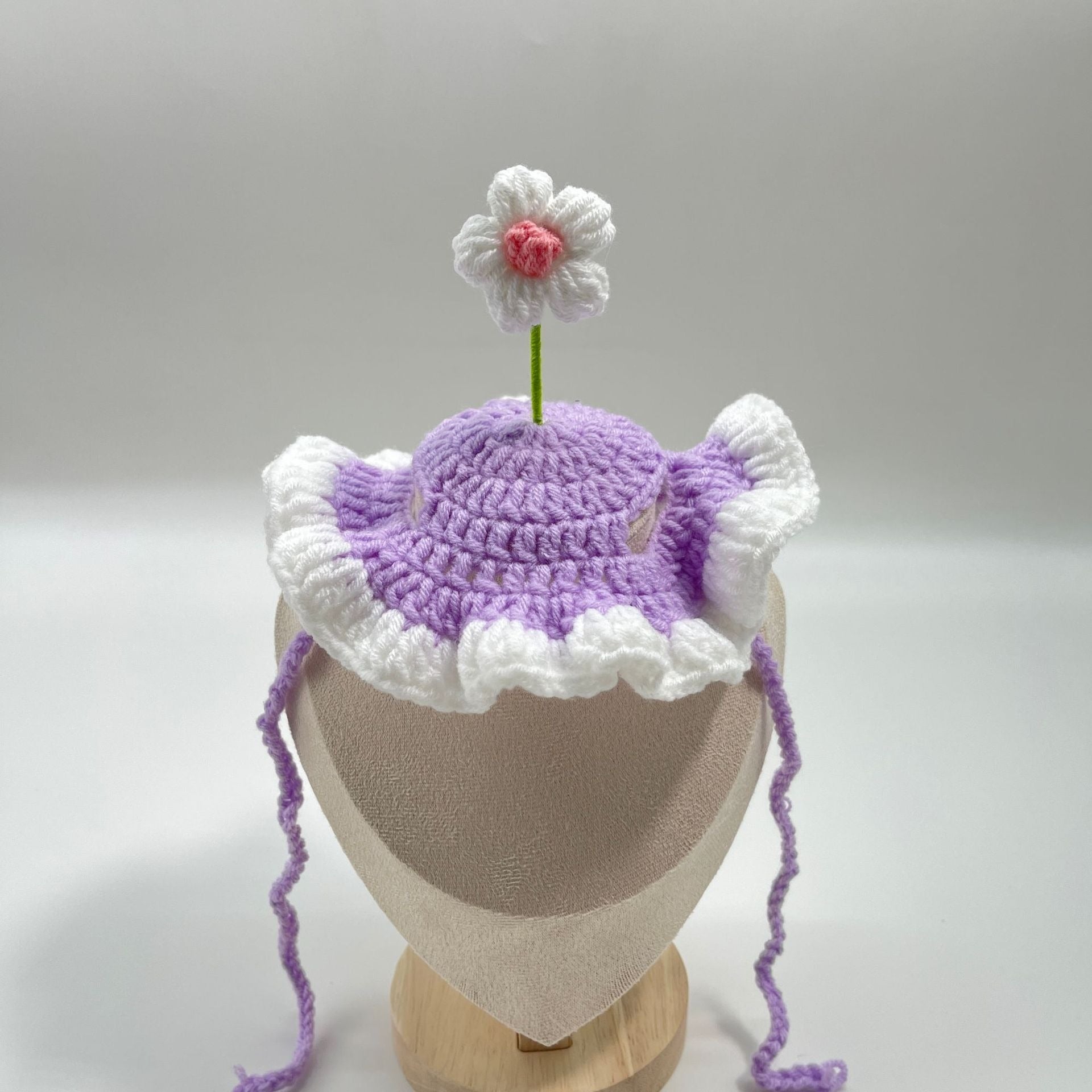 Purple plush pet birthday cake hat with a cake topper, designed for cats and small dogs.