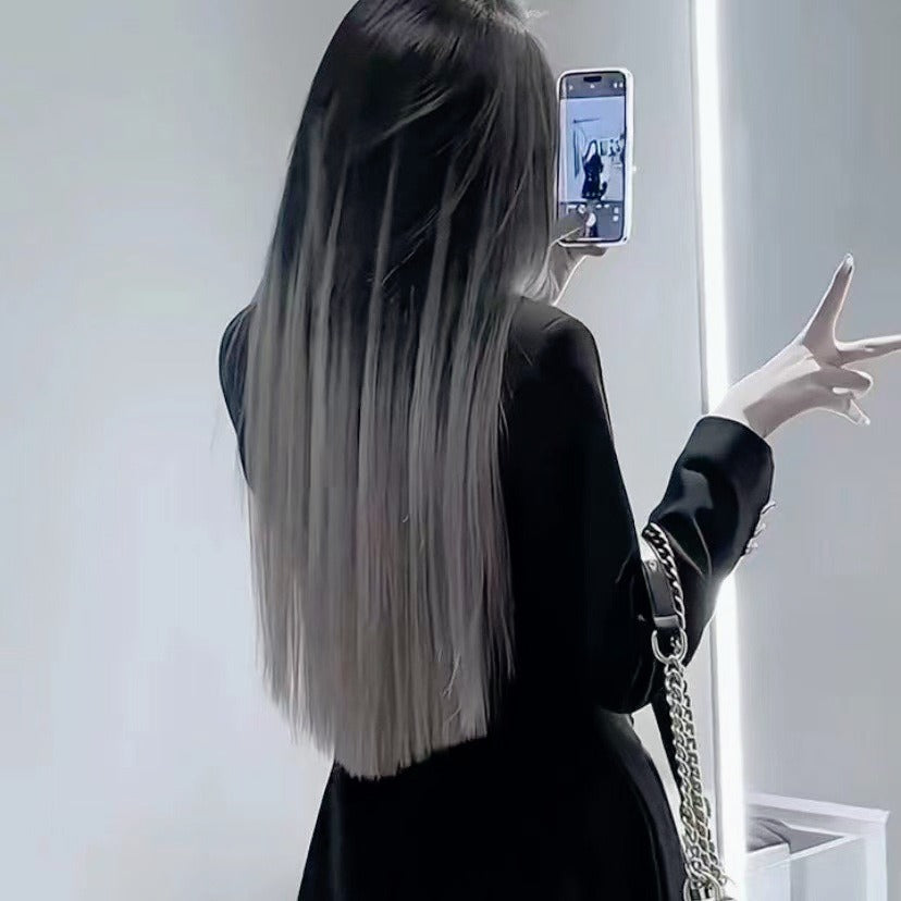 Blue-gray ombre feather hair extensions seamlessly blended with natural hair for a salon-worthy look