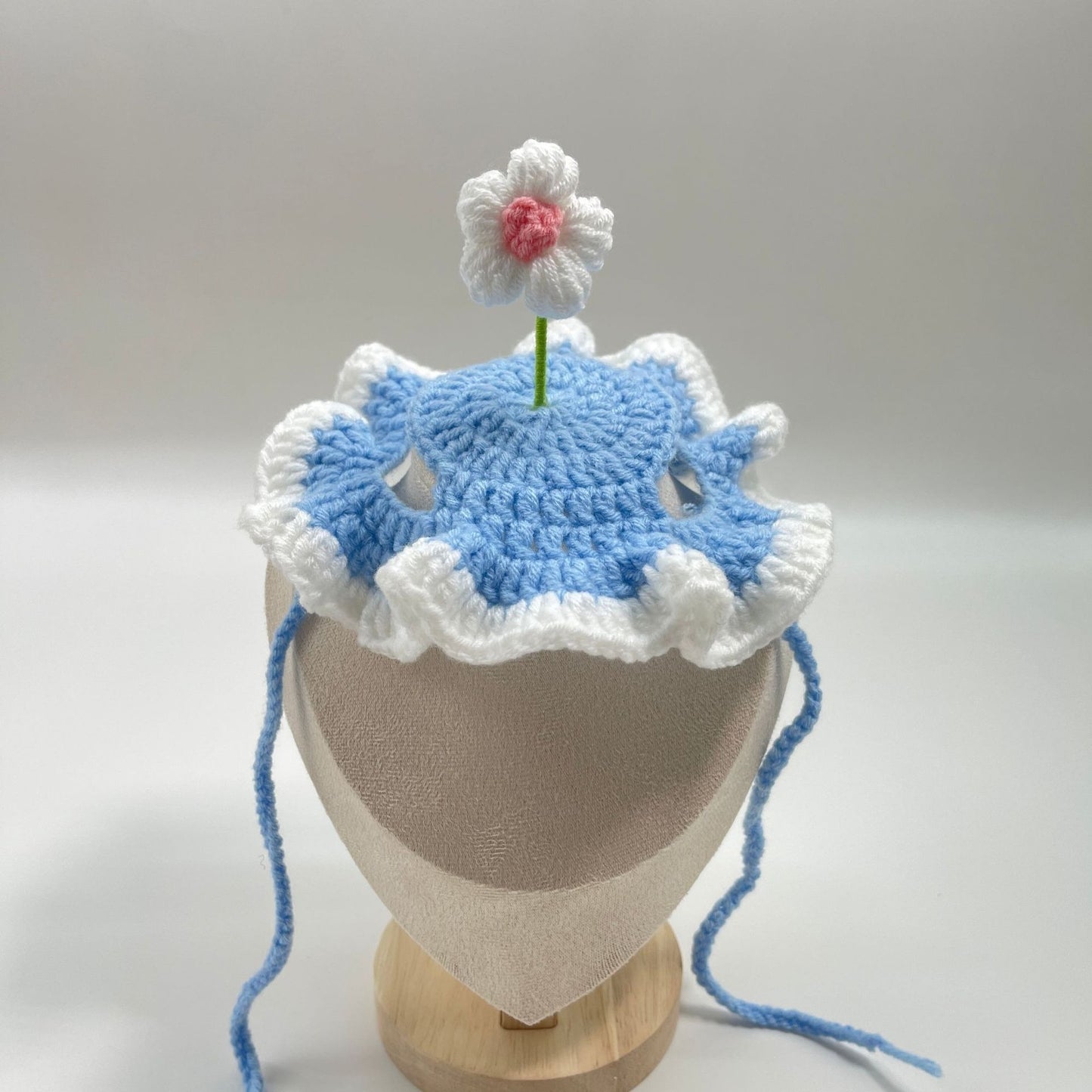 Light blue pet birthday cake hat with a cake topper, designed for pet celebrations