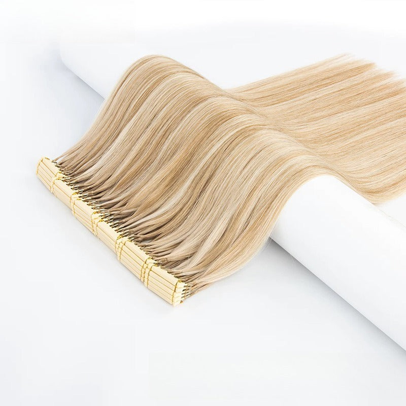 Side view of 6D Generation 1 straight light blonde human hair extensions with golden applicator base